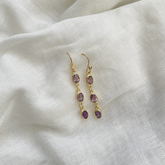 With Six Amethyst gemstones, the most popular of the quartz gemstones, these earrings are a luxurious addition to any jewellery collection and perfect to wear at any occasion. All the Earrings in our collection are delicately and expertly handcrafted in 925 Sterling Silver and are all available in a Silver or Gold Finish.
